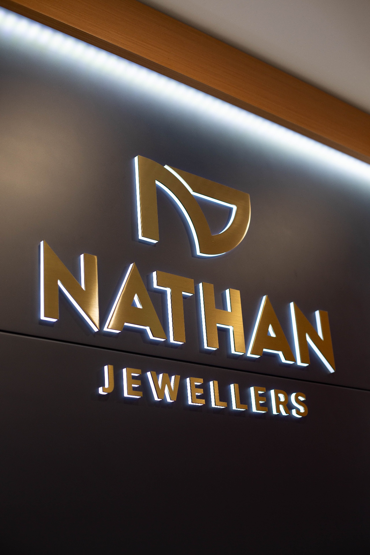 Gold illuminated logo wall